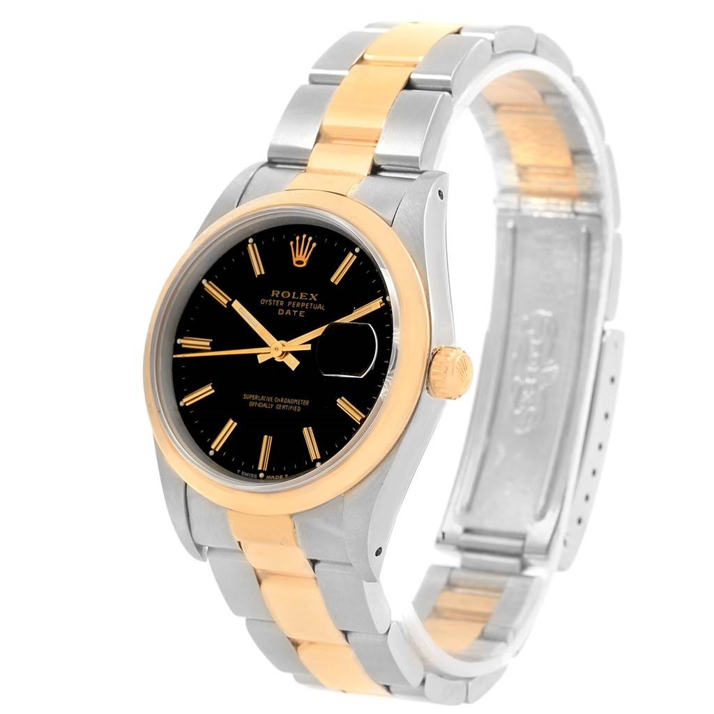 The image shows a Rolex Date 15203 Men's Steel and Gold (two tone) Black Dial 15203 Men's Steel and Gold (two tone) Black Dial model watch from an angled view, highlighting its two-tone bracelet, black dial, and gold bezel.