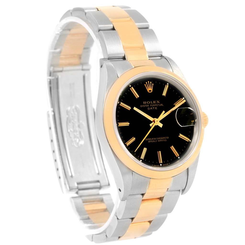 This image shows a Rolex Date 15203 Men's Steel and Gold (two tone) Black Dial 15203 Men's Steel and Gold (two tone) Black Dial model from a slight side angle, highlighting the black dial, gold accents, and bi-metal bracelet.