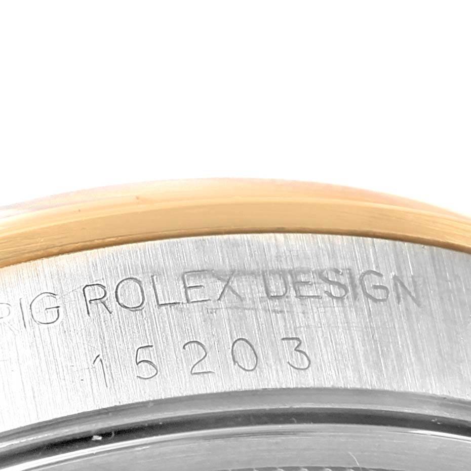 The image shows a close-up of the case back and model number of a Rolex Date 15203 Men's Steel and Gold (two tone) Black Dial 15203 Men's Steel and Gold (two tone) Black Dial watch, displaying the engraved text.