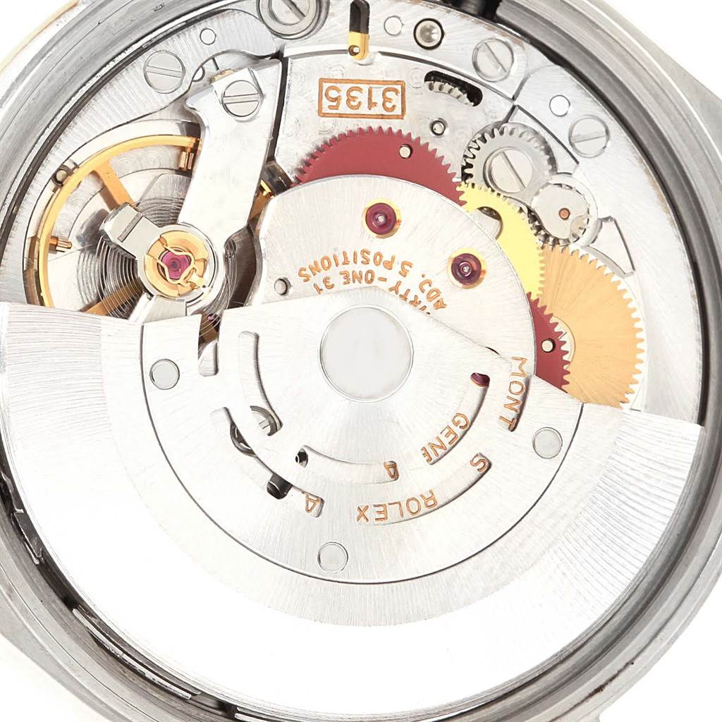 The image shows a close-up of the movement mechanism inside a Rolex Date 15203 Men's Steel and Gold (two tone) Black Dial 15203 Men's Steel and Gold (two tone) Black Dial watch, highlighting gears and internal components.