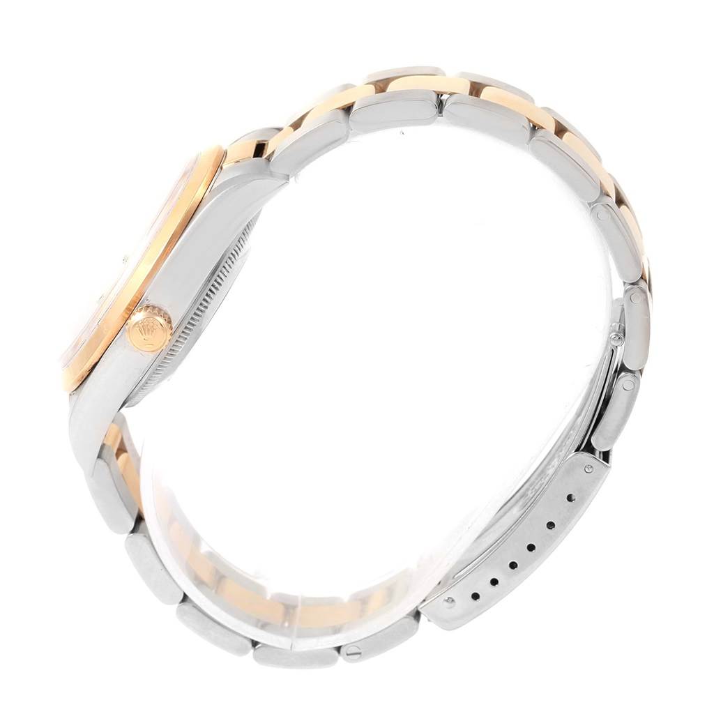 The image shows a side view of a Rolex Date 15203 Men's Steel and Gold (two tone) Black Dial 15203 Men's Steel and Gold (two tone) Black Dial model watch, highlighting its crown, bezel, case, and bracelet with two-tone links.