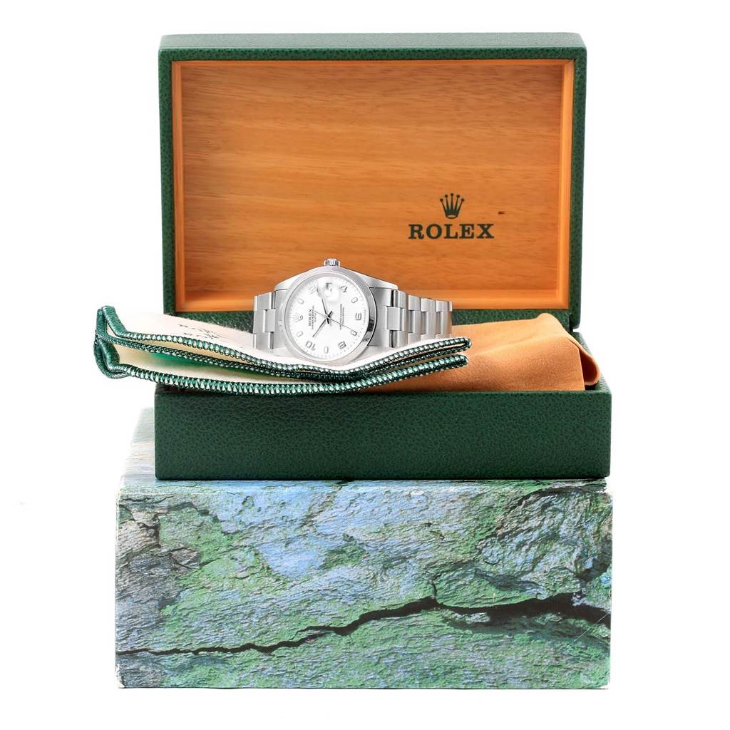 The Rolex Date 15200 Men's Stainless Steel White Dial 15200 Men's Stainless Steel White Dial model watch is shown front-facing, displayed in its opened box, accompanied by accessories.