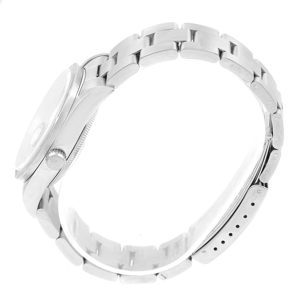 This is a side view of a Rolex Date 15210 Men's Stainless Steel Grey Dial 15210 Men's Stainless Steel Grey Dial model, showing the bezel, crown, and metal bracelet.