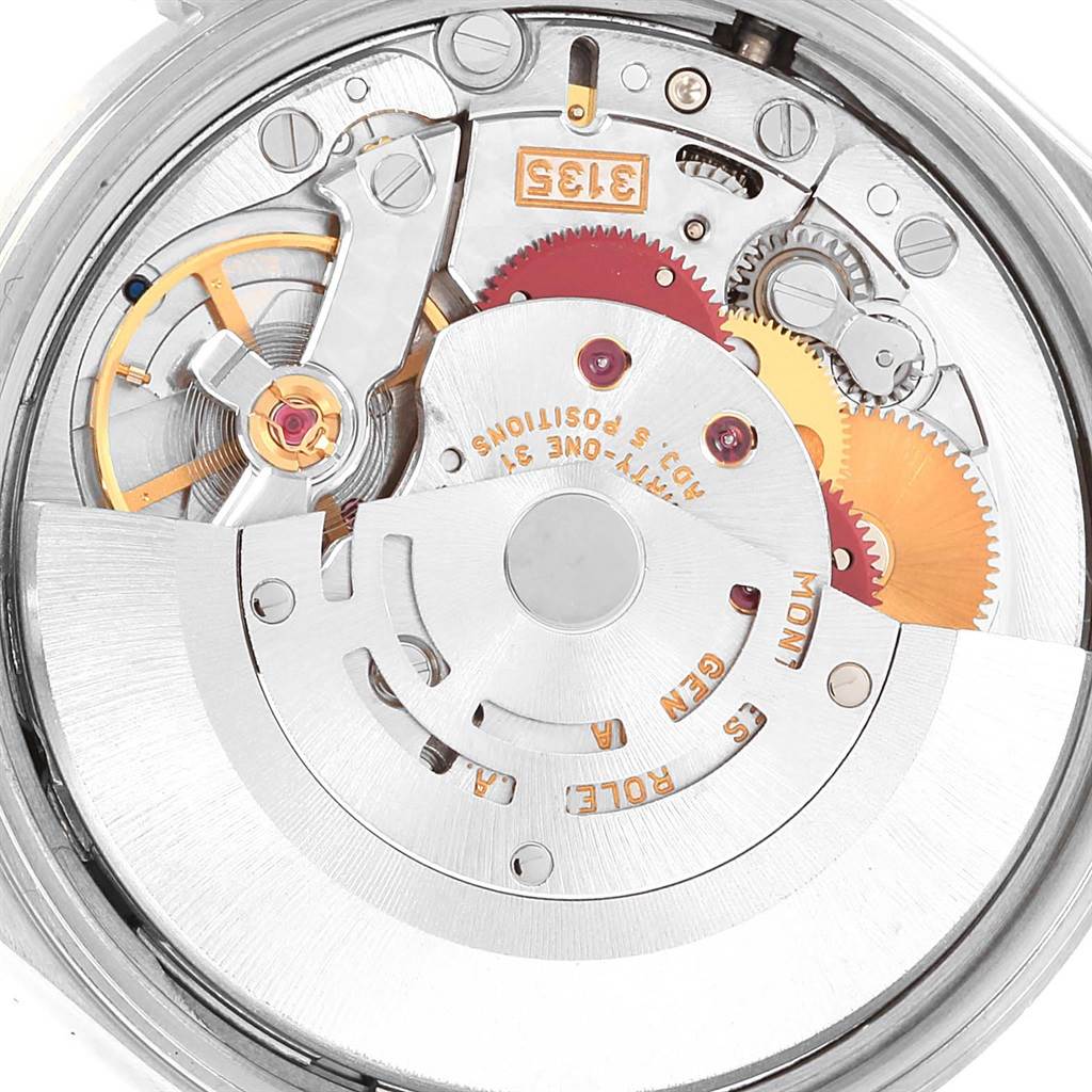 This is a close-up view of the movement of a Rolex Date 15210 Men's Stainless Steel Blue Dial 15210 Men's Stainless Steel Blue Dial model watch, showing its intricate internal gears and components.