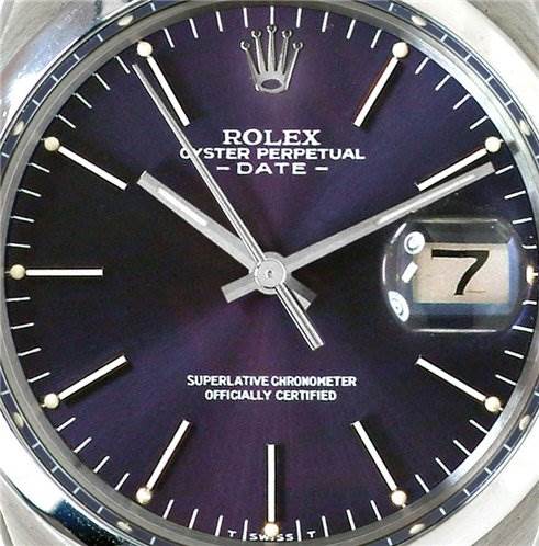 This image shows a close-up of the dial of a Rolex Oyster Perpetual Date watch, featuring the date at the 3 o'clock position.