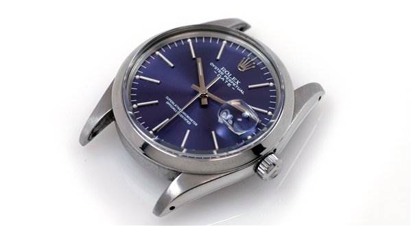 This image shows a top-view angle of the Rolex Date 15000 Men's Stainless Steel Purple Dial 15000 Men's Stainless Steel Purple Dial model watch, highlighting its dial, crown, and case.