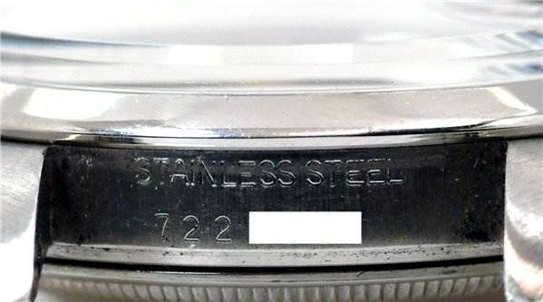 The image shows the case back rim of the Rolex Date 15000 Men's Stainless Steel Purple Dial 15000 Men's Stainless Steel Purple Dial model, highlighting the stainless steel engraving.