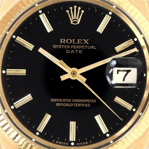 This image shows a close-up of the dial and hands of a Rolex Oyster Perpetual Date watch, focusing on the date window and hour markers.