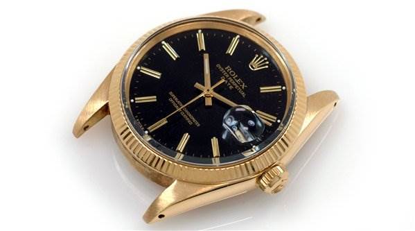 The image shows a Rolex Date 1503 Men's Yellow Gold Black Dial 1503 Men's Yellow Gold Black Dial model watch viewed from an angled top perspective, displaying the case, dial, and crown.