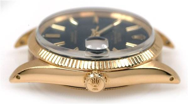 This image shows a side view of a Rolex Date 1503 Men's Yellow Gold Black Dial 1503 Men's Yellow Gold Black Dial model watch case, focusing on the crown and bezel.