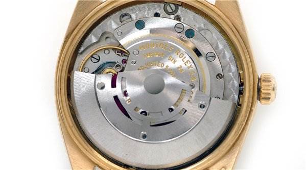 This image shows the internal mechanism and movement of a Rolex Date 1503 Men's Yellow Gold Black Dial 1503 Men's Yellow Gold Black Dial model watch from a top-down angle.