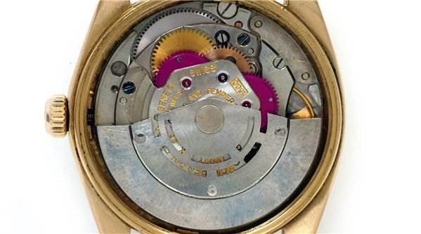 The image shows the internal mechanism of a Rolex Date 1503 Men's Yellow Gold Champagne Dial 1503 Men's Yellow Gold Champagne Dial model watch from a back angle with the case back removed.