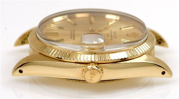 The image shows the side view of a Rolex Date 1503 Men's Yellow Gold Champagne Dial 1503 Men's Yellow Gold Champagne Dial model watch, highlighting the crown, case, and part of the crystal.