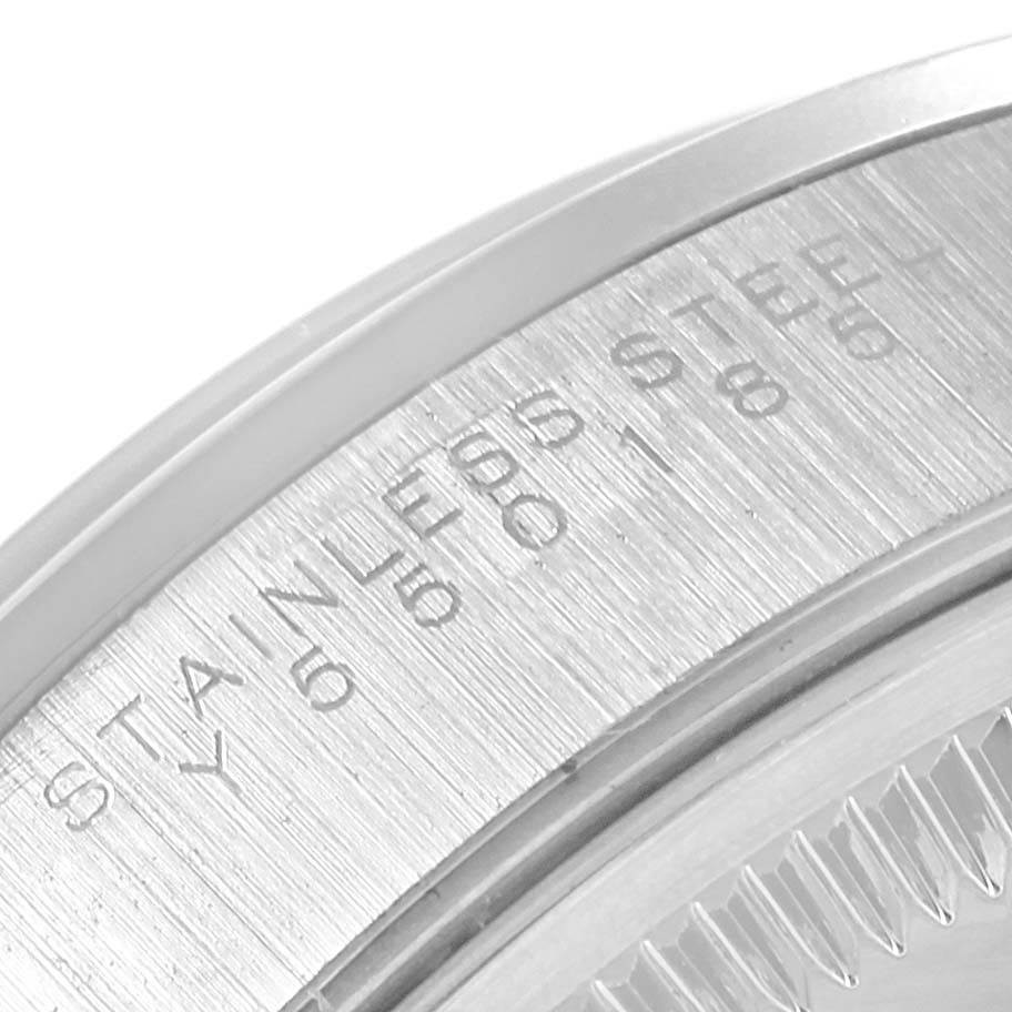 This image shows a close-up angle of the stainless steel case back edge of a Rolex Date 15200 Men's Stainless Steel Blue Dial 15200 Men's Stainless Steel Blue Dial model watch.
