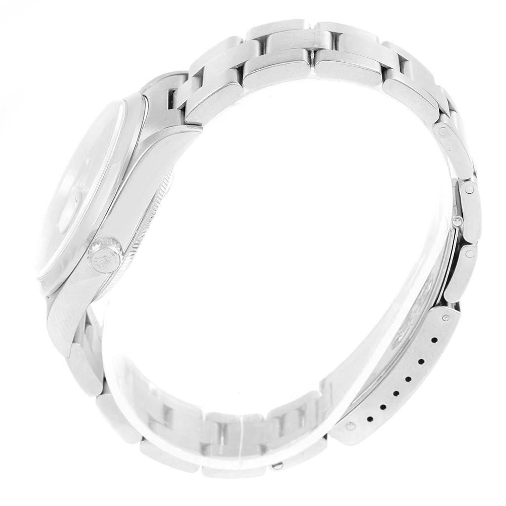 The image shows a side view of a Rolex Date 15200 Men's Stainless Steel Blue Dial 15200 Men's Stainless Steel Blue Dial model watch displaying its bezel, crown, and part of the metal bracelet.