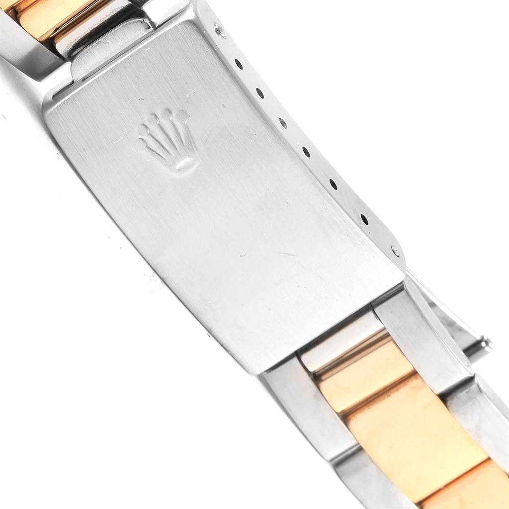 This image shows the clasp and bracelet of a Rolex Date 15223 Men's Steel and Gold (two tone) Black Dial 15223 Men's Steel and Gold (two tone) Black Dial model watch, featuring a two-tone metal design.