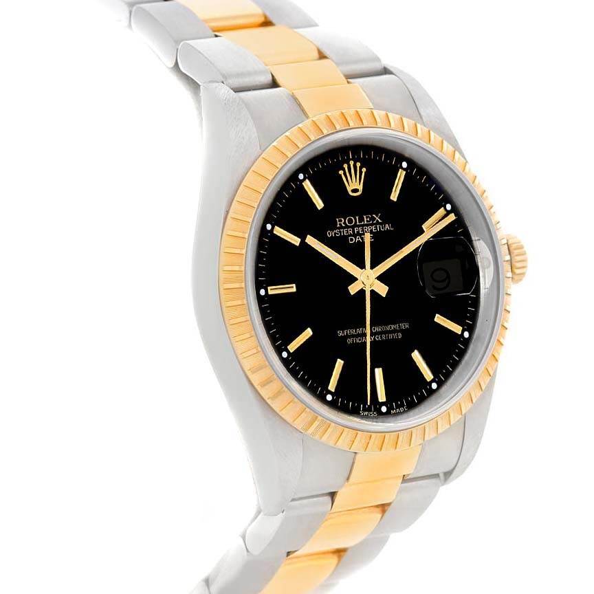 This Rolex Date 15223 Men's Steel and Gold (two tone) Black Dial 15223 Men's Steel and Gold (two tone) Black Dial model watch is shown at an angled view, highlighting its black dial, gold accents, and two-tone bracelet.