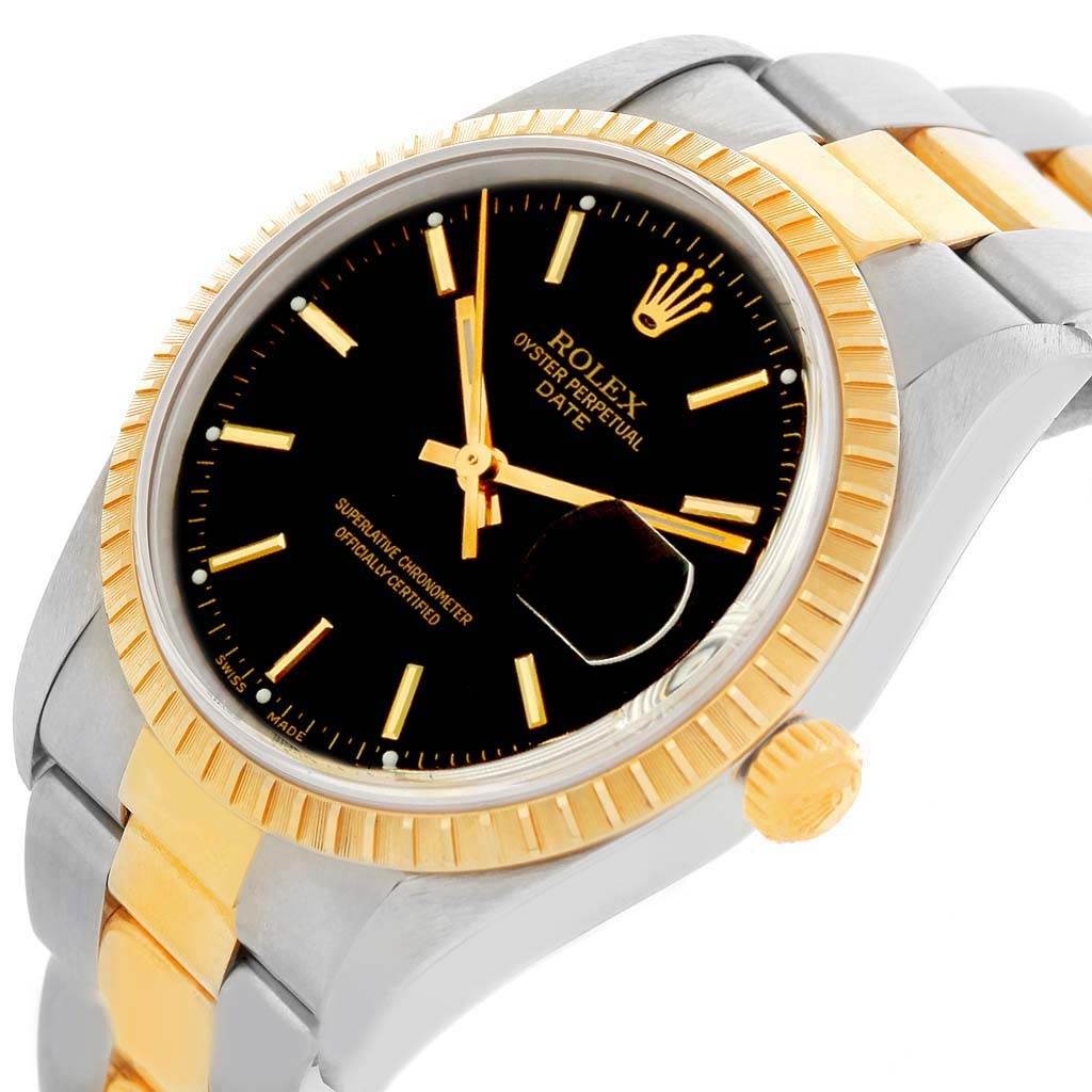 This is a close-up of the Rolex Date 15223 Men's Steel and Gold (two tone) Black Dial 15223 Men's Steel and Gold (two tone) Black Dial watch, showcasing the bezel, crown, dial, and part of the bracelet.