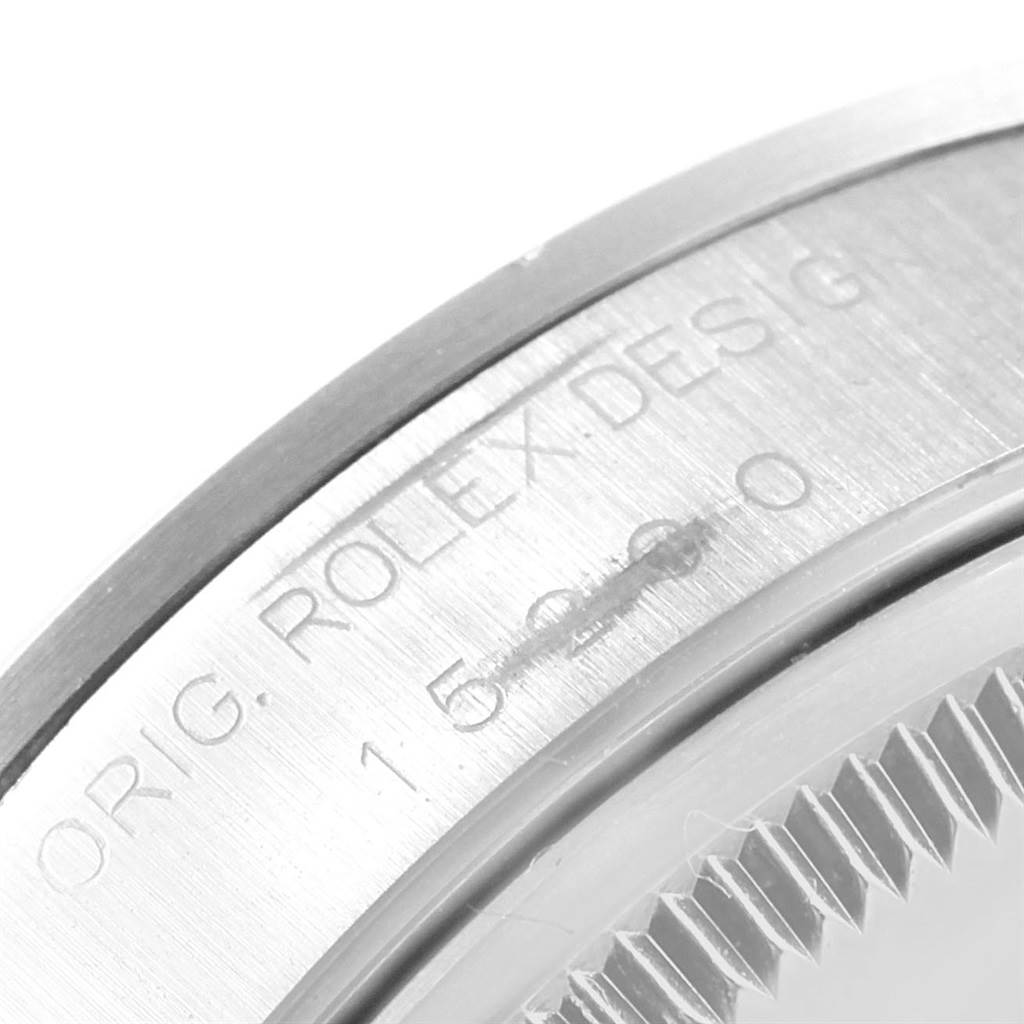 This image shows a close-up view of the side engraving on a Rolex Date 15200 Men's Stainless Steel Black Dial 15200 Men's Stainless Steel Black Dial model watch, highlighting "Orig. Rolex Design" and the serial number.
