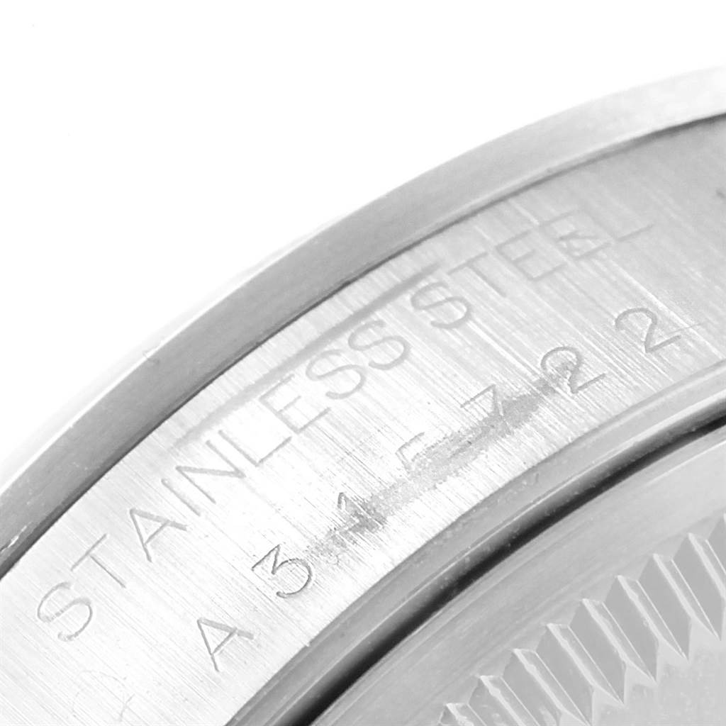 This image shows a close-up of the stainless steel back case with engraving on a Rolex Date 15200 Men's Stainless Steel Black Dial 15200 Men's Stainless Steel Black Dial model watch.
