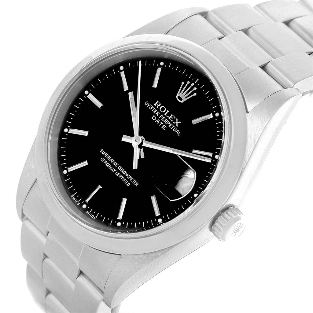 The image shows a close-up, angled view of a Rolex Oyster Perpetual Date watch, showcasing the dial, bezel, and part of the bracelet.