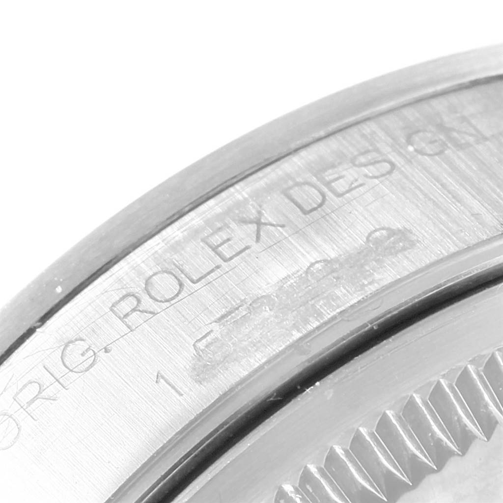 The image shows a close-up of the engraved bezel of a Rolex Date 15200 Men's Stainless Steel Black Dial 15200 Men's Stainless Steel Black Dial model watch.