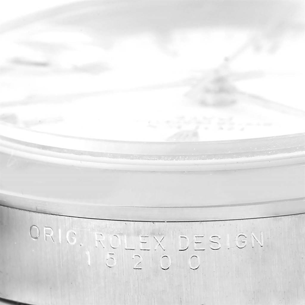 This close-up image of a Rolex Date 15200 Men's Stainless Steel White Dial 15200 Men's Stainless Steel White Dial model shows a side view focusing on the case design engraving and part of the dial.