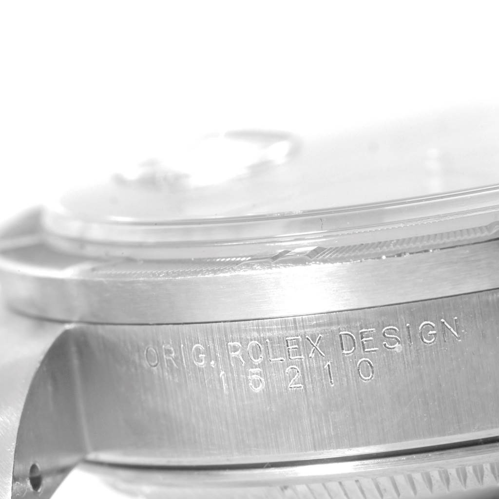 This image shows a close-up side view of the case and engraving of a Rolex Date 15210 Men's Stainless Steel Silver Dial 15210 Men's Stainless Steel Silver Dial model watch.