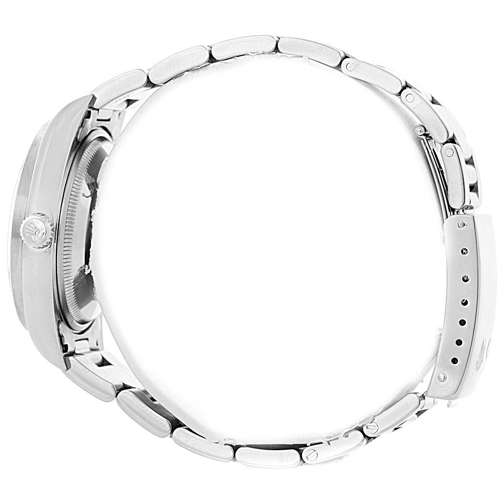 This side view of the Rolex Date 15210 Men's Stainless Steel Silver Dial 15210 Men's Stainless Steel Silver Dial model watch shows the clasp, bracelet, crown, and part of the case.