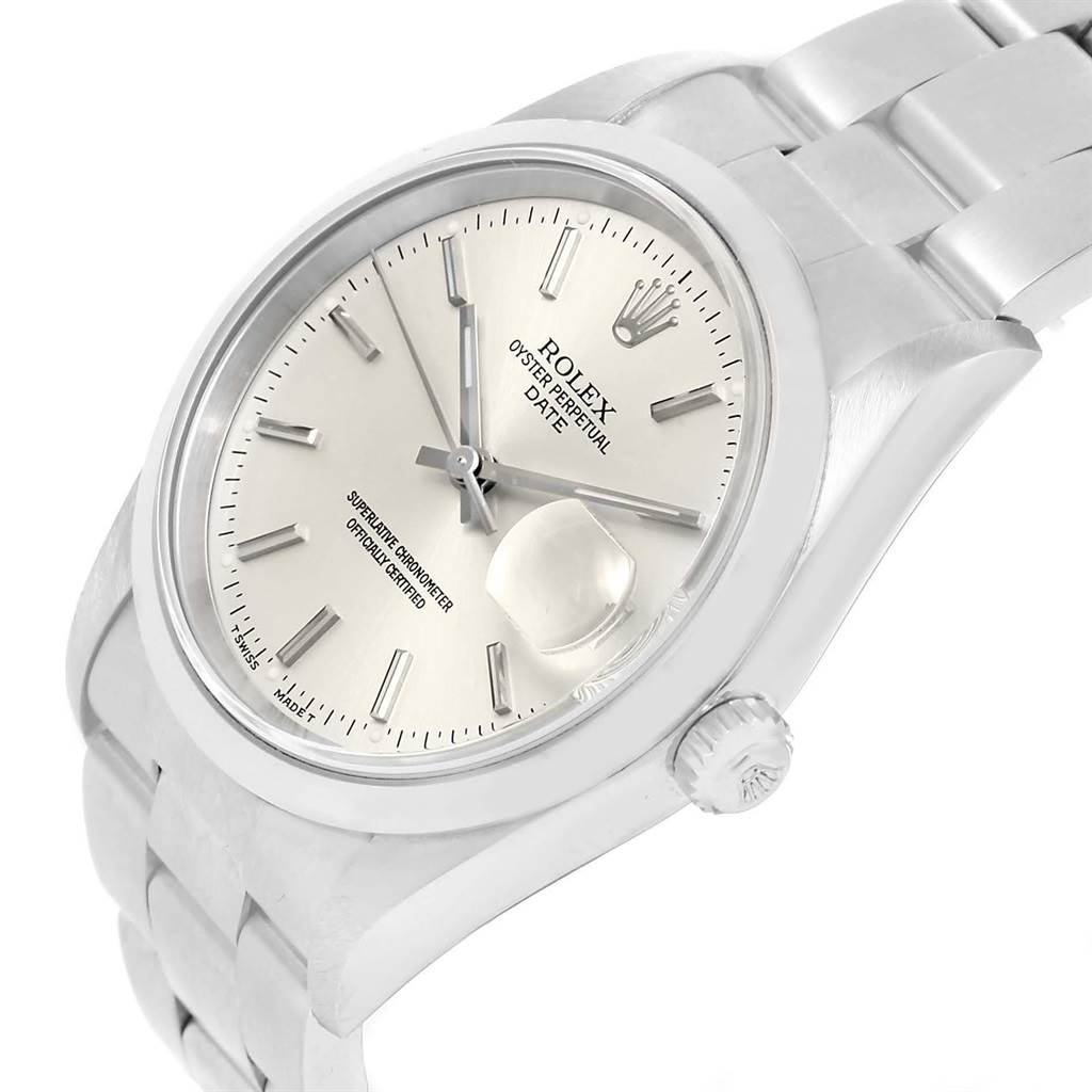 This image shows a close-up angle of a Rolex Oyster Perpetual Date watch, focusing on the dial, bracelet, and crown.