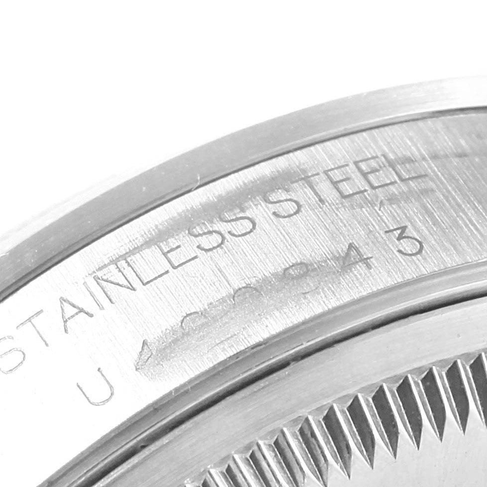 The image shows a close-up of the stainless steel case back and engraved markings of a Rolex Date 15200 Men's Stainless Steel Silver Dial 15200 Men's Stainless Steel Silver Dial model watch.