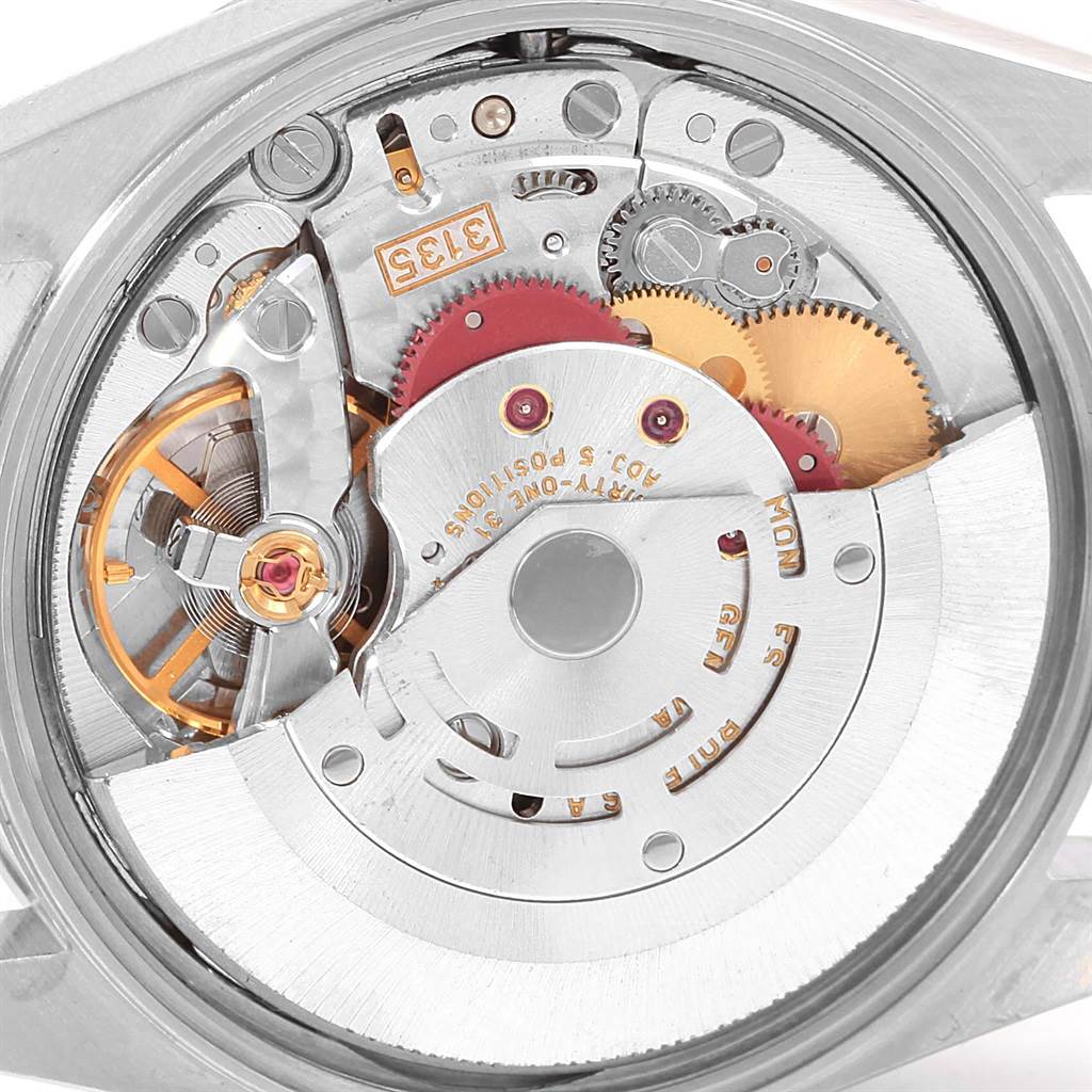 The image shows the intricate internal mechanism of a Rolex Date 15200 Men's Stainless Steel Silver Dial 15200 Men's Stainless Steel Silver Dial model watch from a close-up view, displaying gears and the movement.