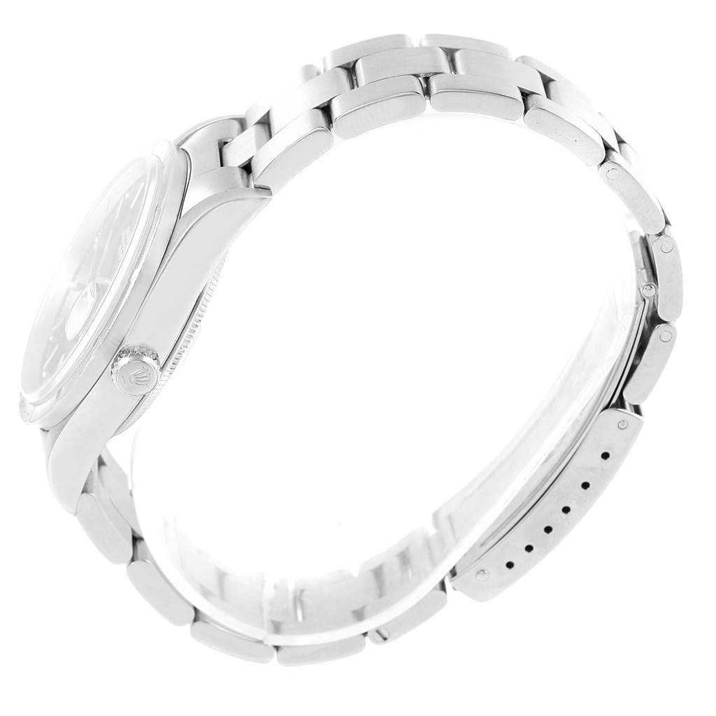 The image shows a side view of a Rolex Date 15210 Men's Stainless Steel Black Dial 15210 Men's Stainless Steel Black Dial model, displaying its case, crown, and stainless steel bracelet links.