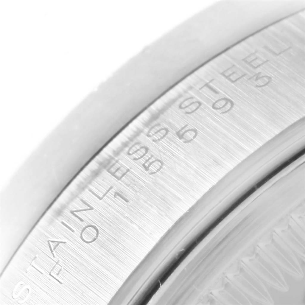 This image shows a close-up of the stainless steel case back edge with engraved text of a Rolex Date 15210 Men's Stainless Steel Black Dial 15210 Men's Stainless Steel Black Dial model.