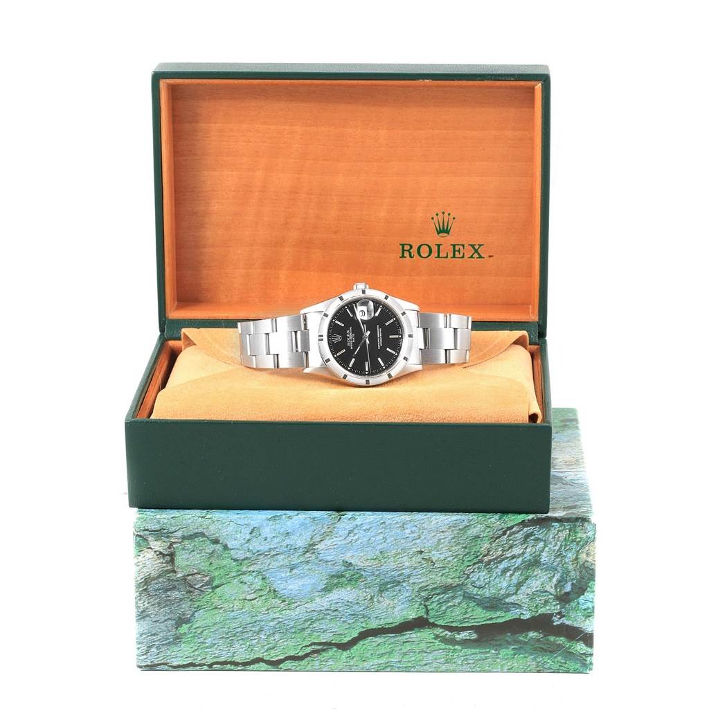 The image shows a frontal view of the Rolex Date 15210 Men's Stainless Steel Black Dial 15210 Men's Stainless Steel Black Dial model watch inside its open box.