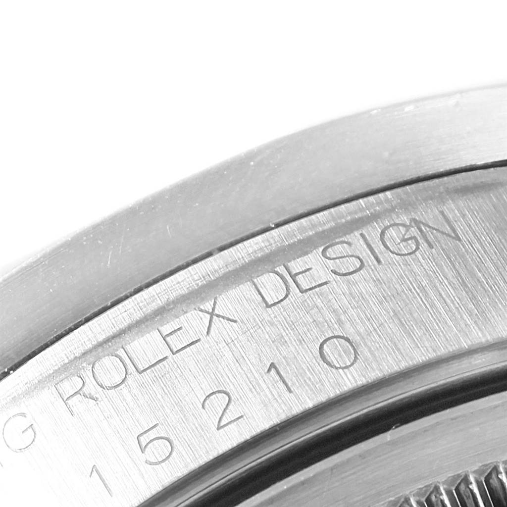 This close-up image shows the engraving on the case back of a Rolex Date 15210 Men's Stainless Steel Black Dial 15210 Men's Stainless Steel Black Dial model watch.