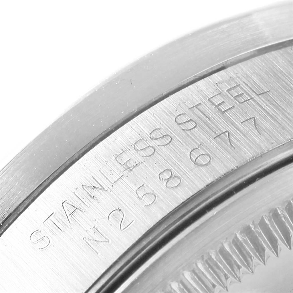This close-up angle shows the engraving on the stainless steel back of the Rolex Date 15210 Men's Stainless Steel Black Dial 15210 Men's Stainless Steel Black Dial model watch.