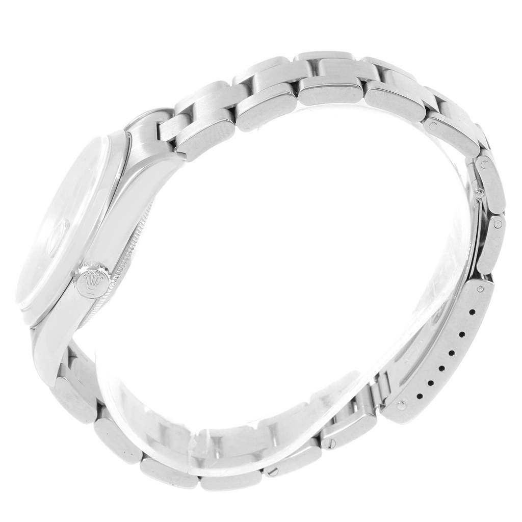 The image shows a side view of a Rolex Date 16200 Men's Stainless Steel Black Dial 16200 Men's Stainless Steel Black Dial model watch, highlighting its case, crown, and bracelet.