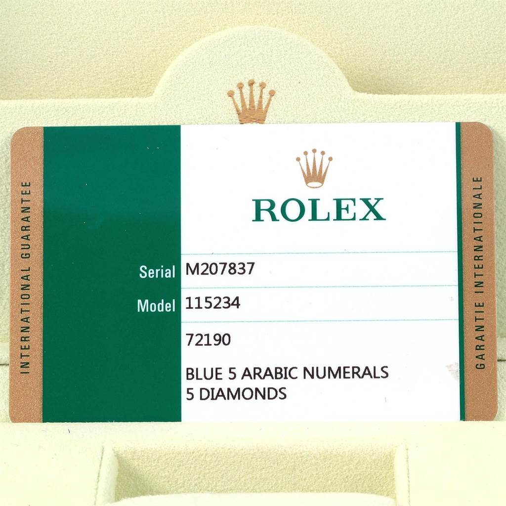 This image shows the international guarantee card for a Rolex Date 115234 Stainless Steel Blue Dial 115234 Stainless Steel Blue Dial model 115234 with specifications.