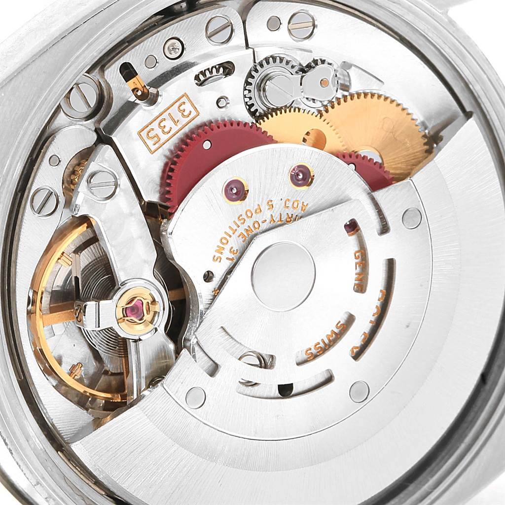 This is a close-up view of the movement mechanism inside a Rolex Date 115234 Stainless Steel Blue Dial 115234 Stainless Steel Blue Dial model watch.