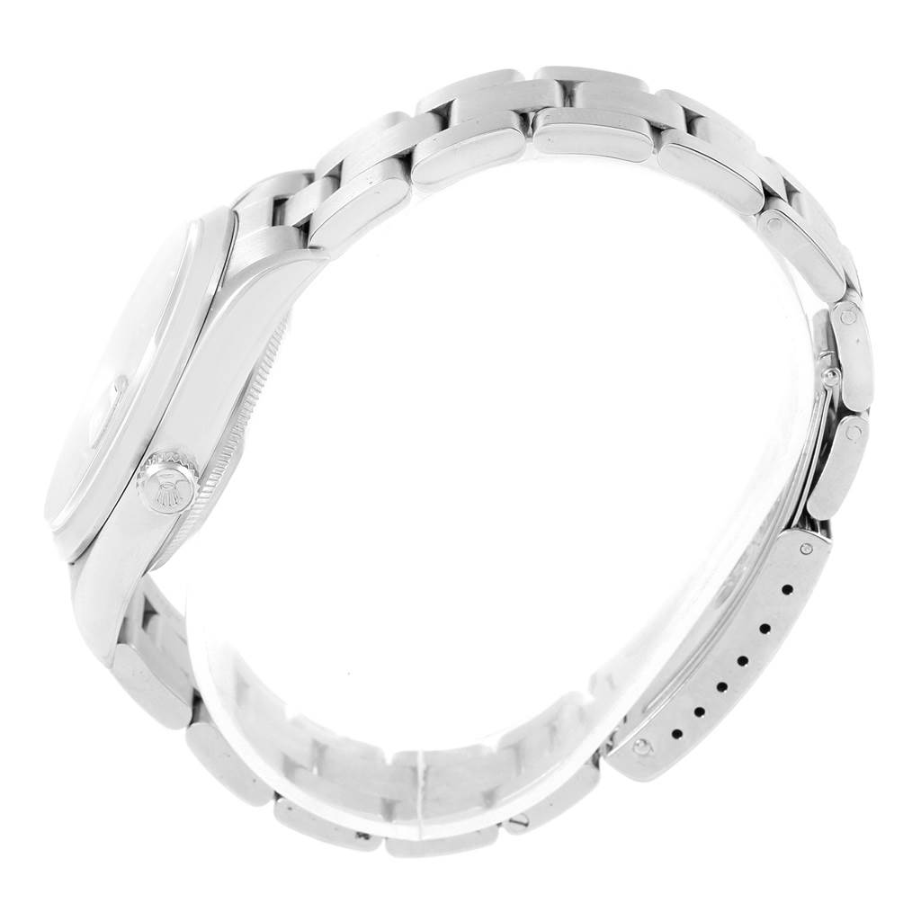 This side-angle view of a Rolex Date 15200 Men's Stainless Steel Black Dial 15200 Men's Stainless Steel Black Dial model watch shows the case, crown, and part of the bracelet.