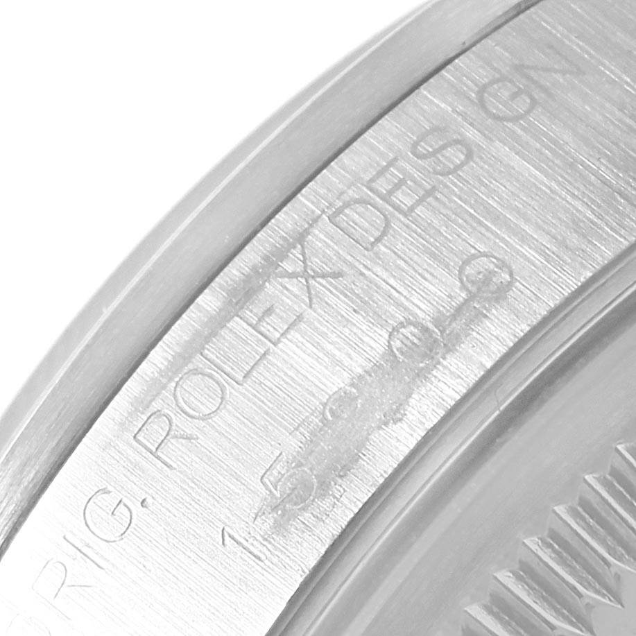 The image shows a close-up of the model and design text engraved on the casing of a Rolex Date 15200 Men's Stainless Steel Black Dial 15200 Men's Stainless Steel Black Dial watch.