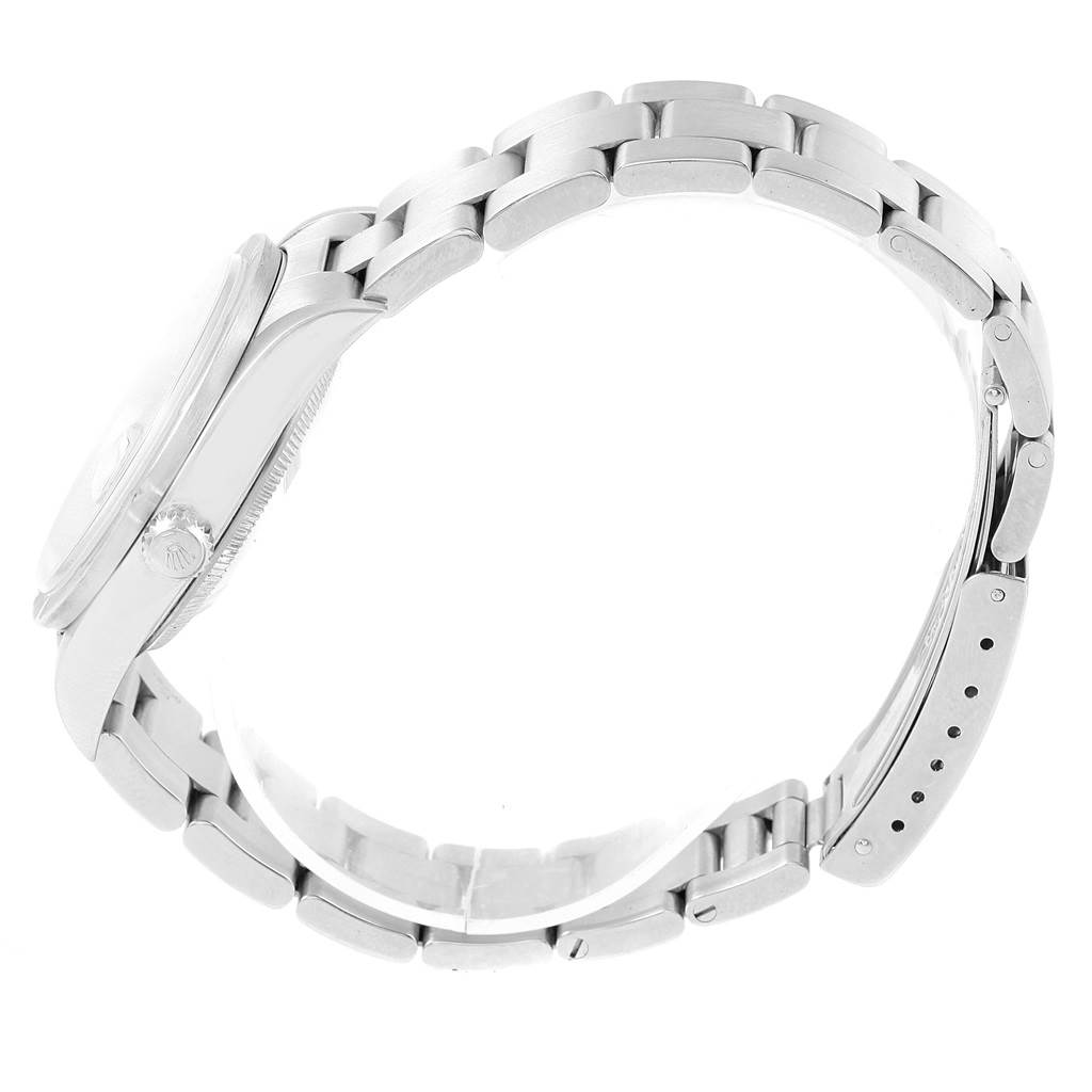 The image shows a side profile view of a Rolex Date 15210 Men's Stainless Steel Blue Dial 15210 Men's Stainless Steel Blue Dial model watch, featuring the case, bracelet, and clasp.