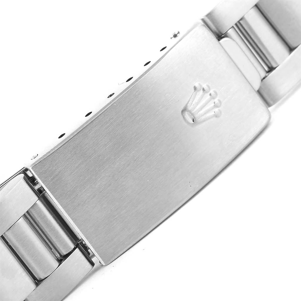 This image shows the clasp of a Rolex Date 15210 Men's Stainless Steel Blue Dial 15210 Men's Stainless Steel Blue Dial model watch, focusing on the detailed crown logo.