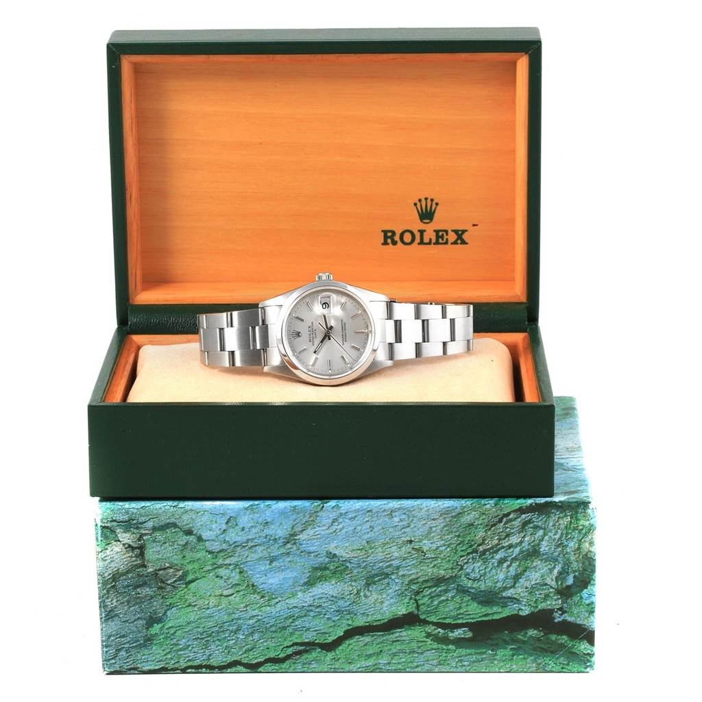The image shows a Rolex Date 15200 Men's Stainless Steel Silver Dial 15200 Men's Stainless Steel Silver Dial model watch, displayed inside an open green and wood-tone Rolex box.
