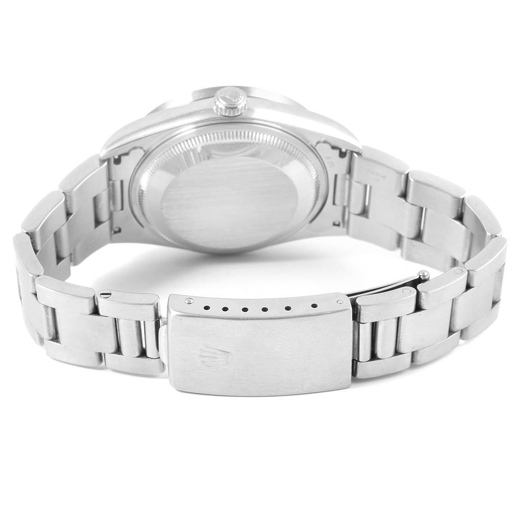 The image shows the back case and bracelet clasp of a Rolex Date 15210 Men's Stainless Steel Blue Dial 15210 Men's Stainless Steel Blue Dial model watch.