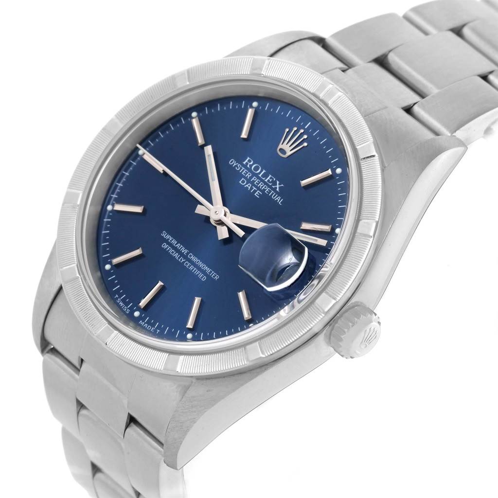 The image shows a Rolex Date 15210 Men's Stainless Steel Blue Dial 15210 Men's Stainless Steel Blue Dial model watch from a front angle, highlighting the blue dial, date cyclops lens, and stainless steel bracelet.
