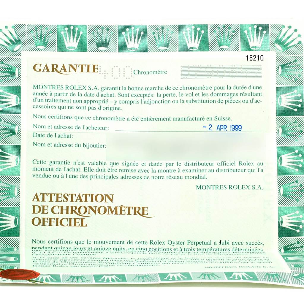 The image shows the warranty and official chronometer certification for a Rolex Date 15210 Men's Stainless Steel Blue Dial 15210 Men's Stainless Steel Blue Dial model watch, highlighting the date of purchase and relevant guarantee information.