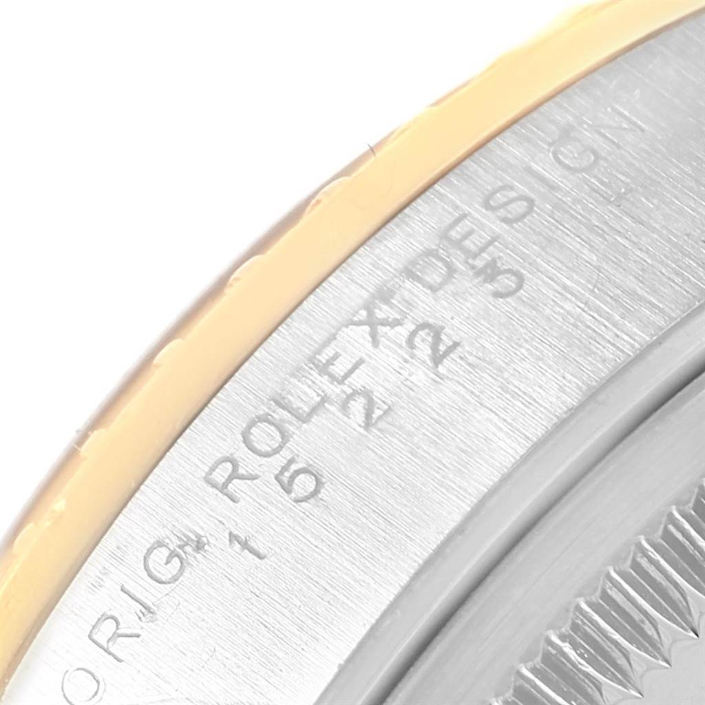 The image shows a close-up of the side inscription on the bezel of a Rolex Date 15223 Men's Steel and Gold (two tone) Black Dial 15223 Men's Steel and Gold (two tone) Black Dial model watch.