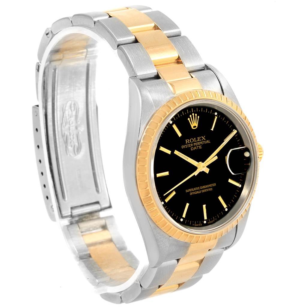 This image shows a Rolex Date 15223 Men's Steel and Gold (two tone) Black Dial 15223 Men's Steel and Gold (two tone) Black Dial model watch at a three-quarter angle, highlighting its black dial, gold bezel, and two-tone metal band.